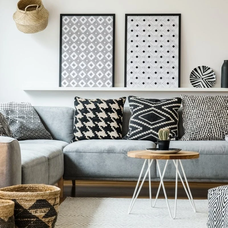patterned-pillows-on-grey-corner-sofa-in-apartment-interior-with-qedv5q70fsw55ksfvxyyrt1bmpu3909f3qicz7gytc